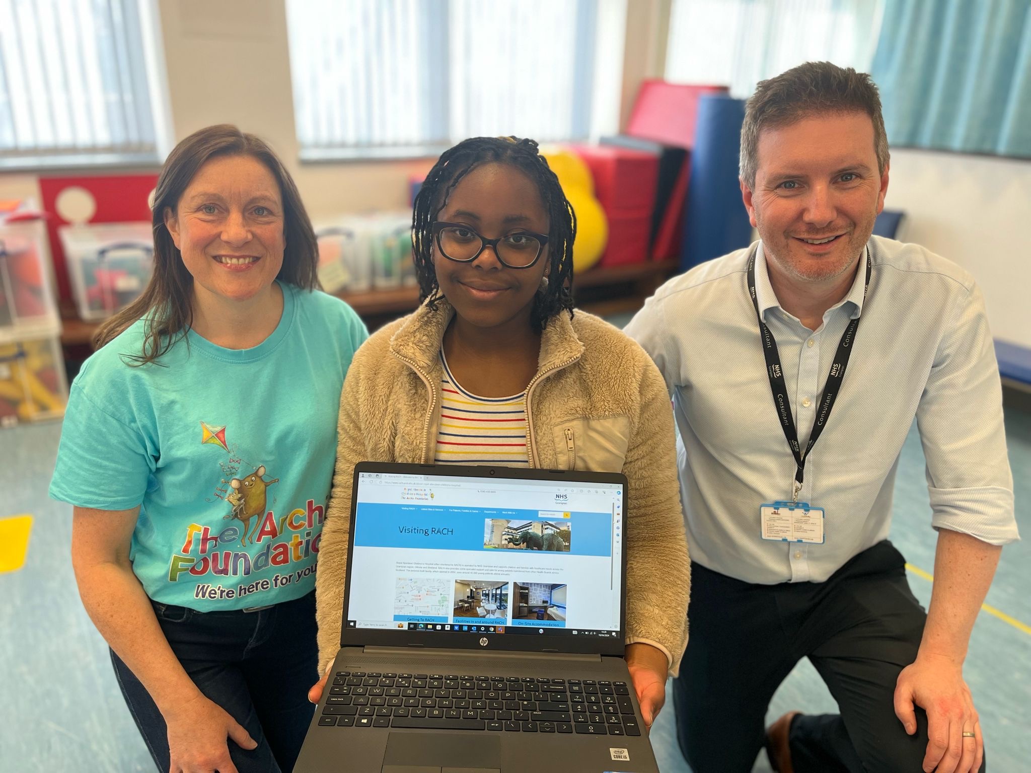 The Uwuijaren family with NHS Grampian staff and Paula from The Archie Foundation at Royal Aberdeen Children’s Hospital.