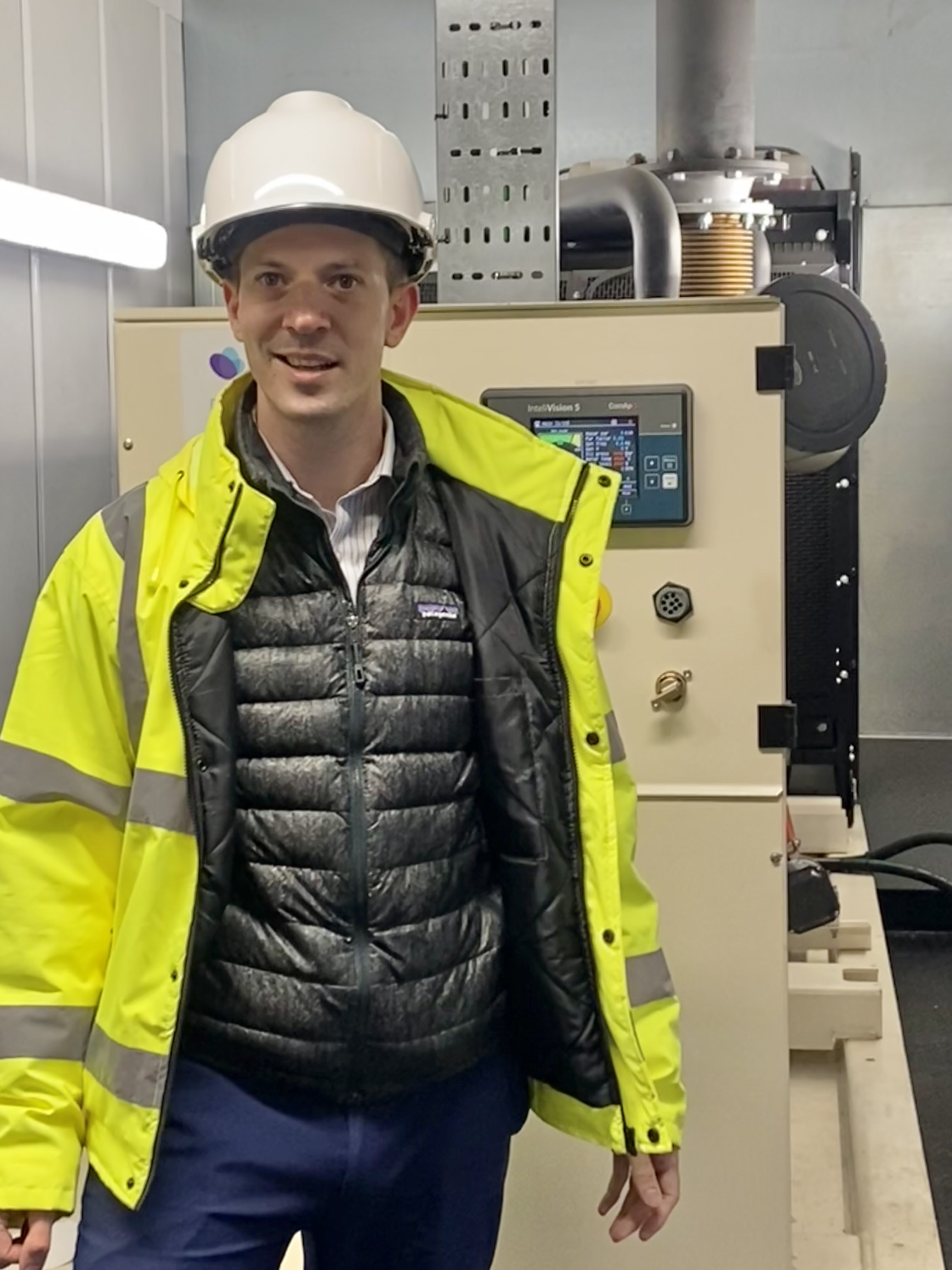 NHS Grampian to use waste oil and fats for back-up generators, ©NHS Grampian Photograph of Robert Hobkirk, Head of Sustainability Compliance and Risk at NHS Grampian, beside a back-up generator tank at the Foresterhill Health Campus.