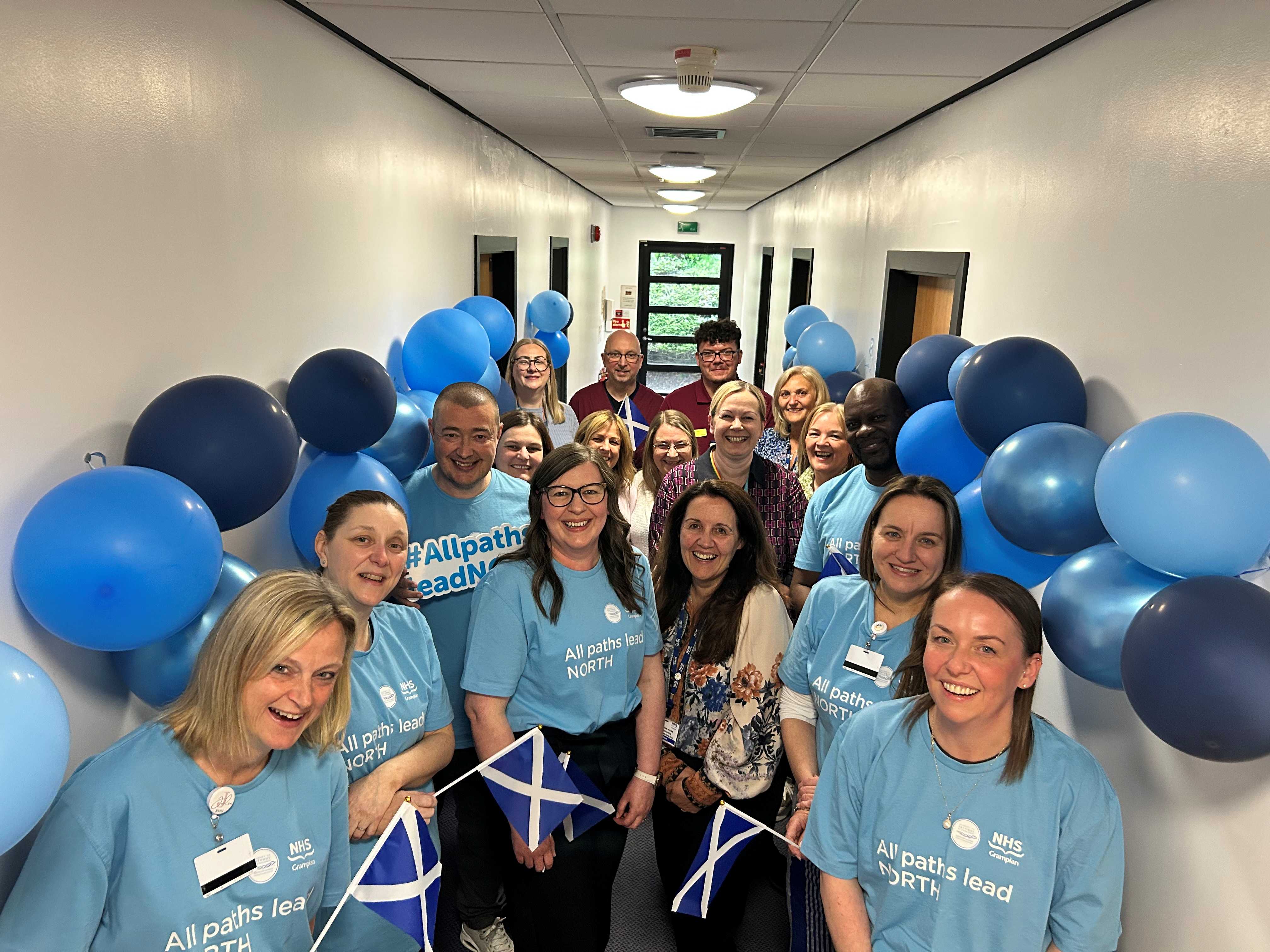 Colleagues at Royal Cornhill Hospital, Aberdeen come together with NHS Grampian senior executive team members to celebrate achieving Pathway to Excellence.