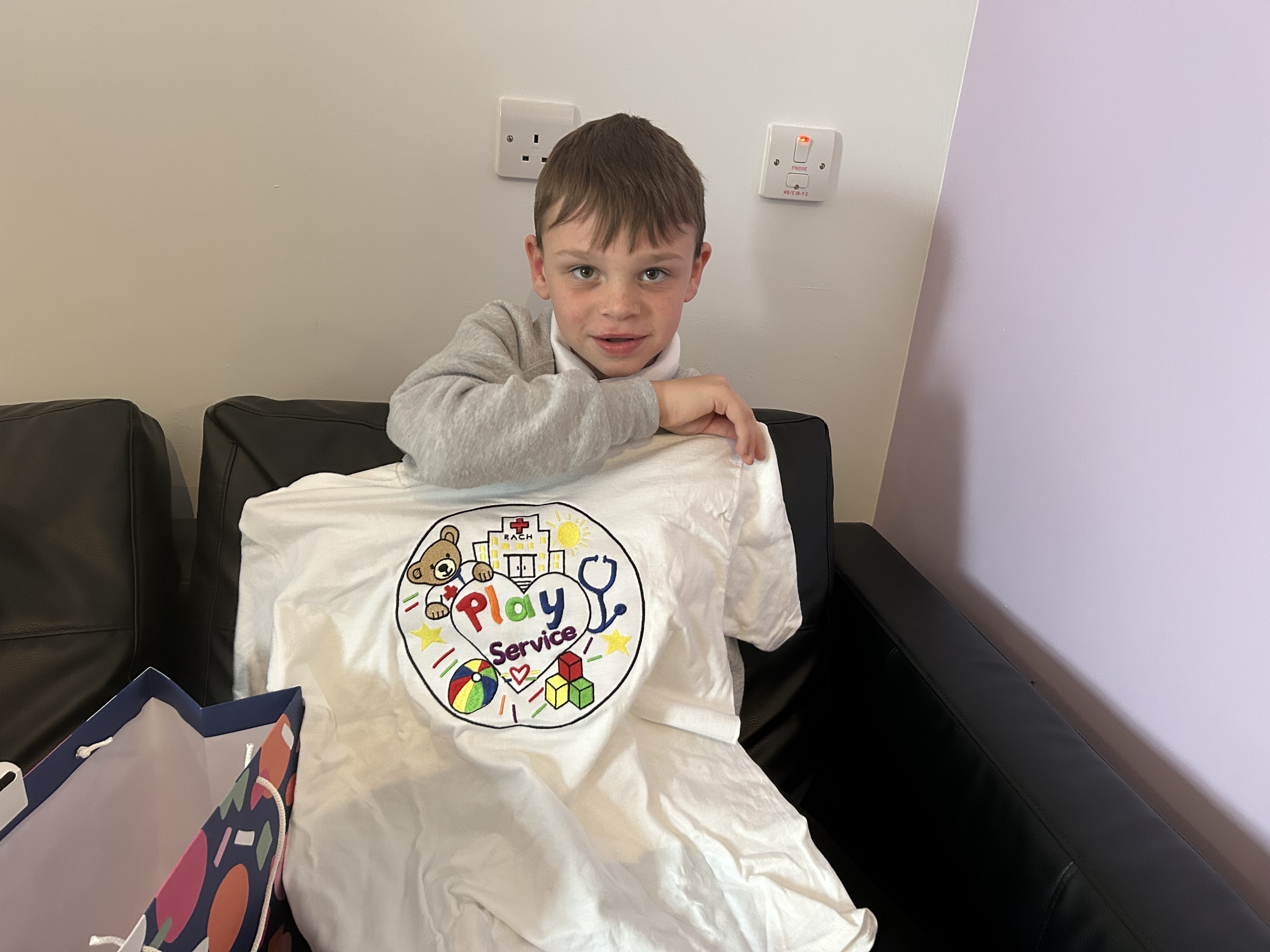 Aiden shows off his t-shirt design